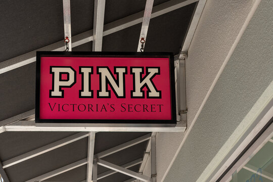  
Houston, Texas, USA - March 2, 2022: PINK Victoria's Secret store hanging sign at an outlet mall in Houston, Texas, USA. Pink is a lingerie and apparel line by Victoria's Secret. 
