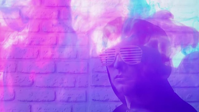 Futuristic modern background with a man in glasses, copy space, chloe on an iridescent background with colored smoke abstraction