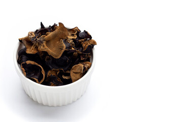 Dried black fungus on white background.