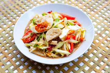 Spicy papaya salad with salted egg and vietnamese pork sausage