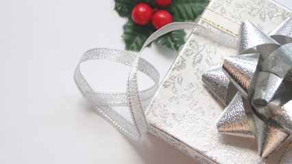 silver gift box and silver ribbon on white background