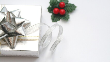 silver gift box and silver ribbon on white background