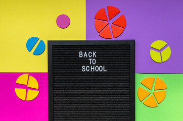 Letter board with pencils and colorful fractions  mathematics. Interesting fun math for kids,...