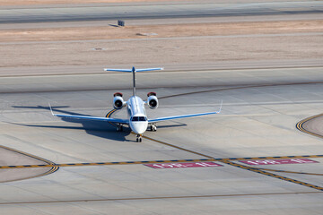 Luxury business jet airport on the taxiway at an airport after landing.