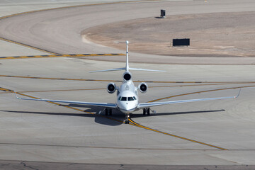 Luxury business jet airport on the taxiway at an airport after landing.