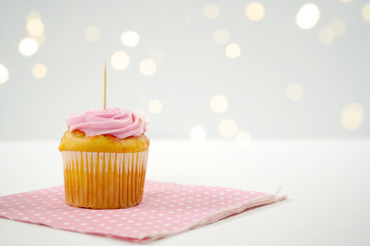 Pink Strawberry Cupcake Topper Mockup. Styled against a white background with bokeh party fairy lights. Copy space for your design here.