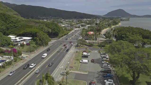Scenic Hawaiian highway with traffic and tow truck