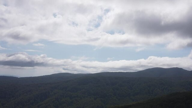 Victorian high country mountain range, focusing on cloudy sky above in Mt Buller