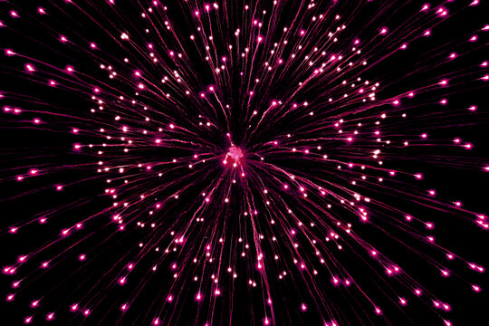 Close up photo of fireworks exploding in the night sky	