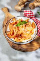 Pasta penne with tomato sauce and parmesan.