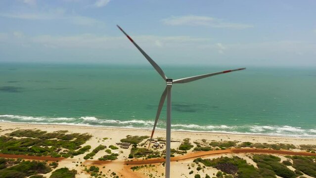 Aerial view of Wind turbines for electric power production on the seashore. Wind power plant. Ecological landscape. Mannar, Sri Lanka.