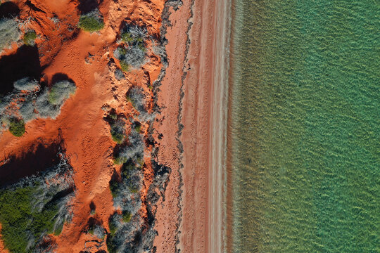 Aerial Drone View Of Coastal Sea Shore Red Cliffs And Turquoise Water