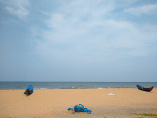 Fototapeta na wymiar Fishing boats on the beach, pozhikkara beach, Kollam district, Kerala, seascape view