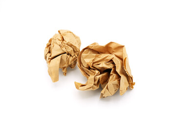 Brown crumpled disposable Kraft paper bag on white background.