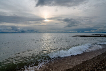 View of the Black Sea on the coast of Sochi against the sunset sky, Sochi, Krasnodar Krai, Russia