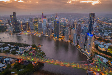 Aerial Brisbane City, Queensland Australia Downtown Region Aerial Night Highway cars streak Sunset Dusk Evening River All Logos Blurred