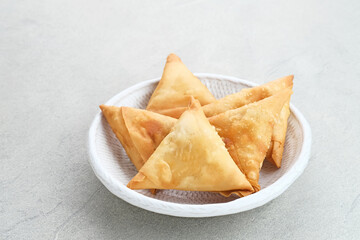 Samosa Keju, a crispy triangle fried pastry snack with cheese filling. 
