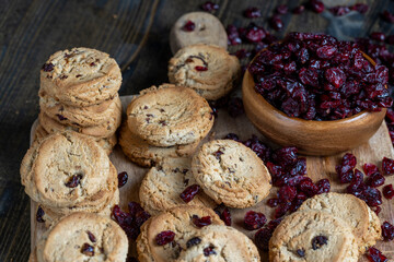 delicious dried cookies made of high-quality flour with dried red cranberries on the table