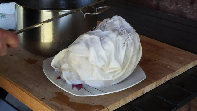 cooking cappello del prete boiled meat , traditional dish from northern, Italy