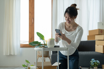 Happy young businessman owner packing order to cardboard box, Young Owner Woman Start up for Business Online. People with online shopping SME entrepreneur or freelance working concept