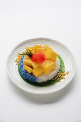 Ripe Mango with Coconut Flavored Sticky Rice on white dish, .Popular Thai desserts,Food and Desserts concept.