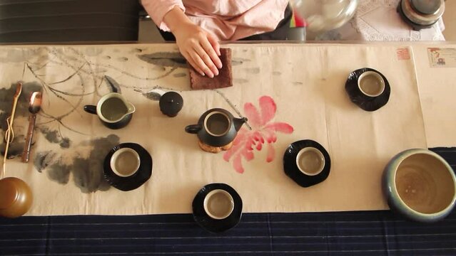 The tea master makes tea on the table