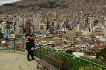La Paz, Bolivia - 30 January 2017: Couple hugs on the observation deck. La Paz, Bolivia