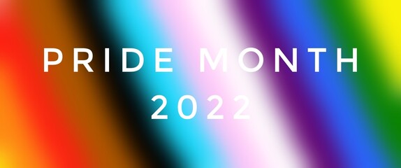 Texts 'PRIDE MONTH 2022', on blurred lgbtq+ flags background, concept for lgbtq+ community celebrations in pride month, june, 2022.