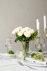 The wedding decor. Wedding table decoration with white roses
