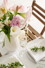 The wedding table setting and decor on wooden table in rustic style