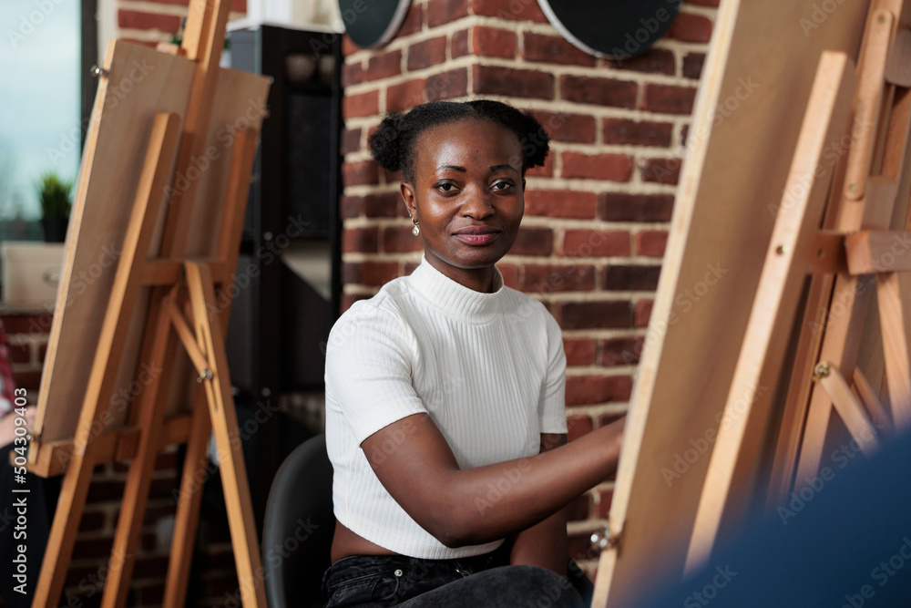 Poster Portrait of painter student sketching vase on white canvas drawing model using graphic pencil in creativity studio. Diverse team attenting art course developing new artistic skill for personal growth