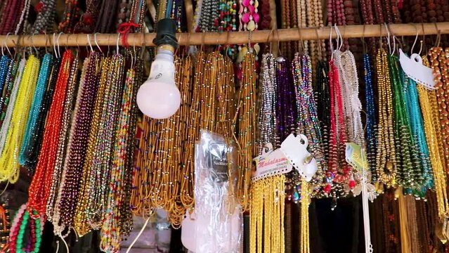 colorful garland jewelery many at shop for sale at day from flat angle in details
