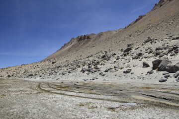 The slope of the mountain with huge stones. Off-road tour on the salt flat Salar de Uyuni in Bolivia.