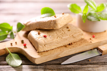 fresh tofu and basil on wooden board