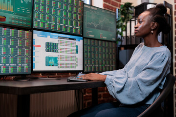 Forex agency investor looking at financial graphs trying to take investment profits without losing...