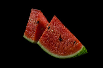 watermelon slice isolated on black backgound
