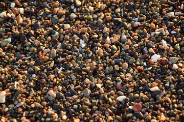 Small pebbles on the ocean coast clouse-up. Antofagasta, Chile.