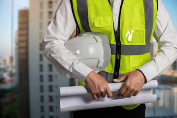 Young Engineer Architect Design Concepts, Building Structures on Blueprints to Present to Clients Engineering Concepts.