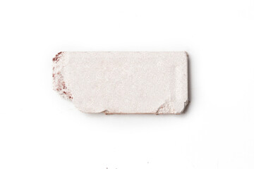 Smashed neutral toned makeup sample isolated on white background