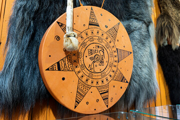 Ancient indian tambourine drum drumstick replica, bear skin - obrazy, fototapety, plakaty