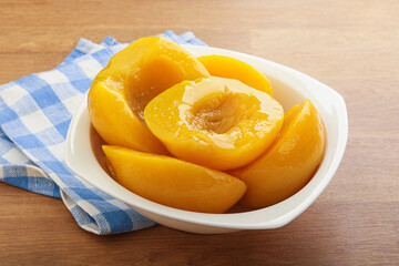 Sweet canned peaches with syrope