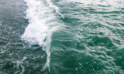 Wave in the sea with splashing water.