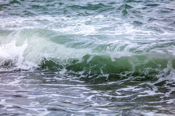 Wave in the sea with splashing water.