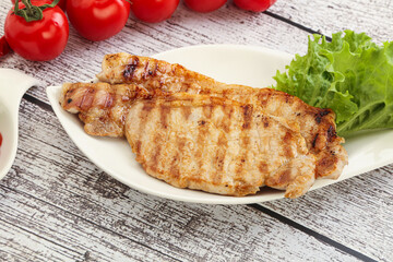 Grilled pork steak with ketchup