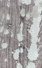 Obraz premium Drops and splashes from concrete on a wooden board