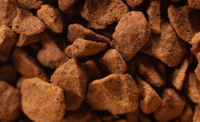 Instant coffee granules as background.