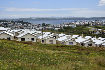 Fototapeta na wymiar QUELLON, CHILE. Residential area with typical wooden houses