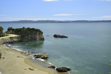 QUELLON CHILE. View of the rocky ocean coast