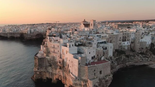 polignano a mare old town aerial shot drone at dawn high view,small rocks village in puglia italy 4k