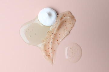 Various cosmetic creams on pastel background. Background of cosmetic products strokes